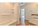 Bathroom showcases shower and tub combination with built-in shelves at 2323 Mariposa Ave, Las Vegas, NV 89104