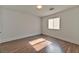 An airy bedroom with wood-look laminate floors, a window and neutral colored walls at 2323 Mariposa Ave, Las Vegas, NV 89104