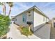 Side view of a cozy home with a well-maintained yard, tidy landscaping, and clear house number at 2323 Mariposa Ave, Las Vegas, NV 89104