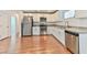 Bright kitchen featuring white cabinets, stainless steel appliances, and sleek countertops at 2323 Mariposa Ave, Las Vegas, NV 89104