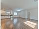 Open-concept living area featuring wood floors, white walls, and a modern chandelier at 2323 Mariposa Ave, Las Vegas, NV 89104