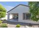 Inviting backyard patio with seating, providing a peaceful retreat in a beautifully landscaped setting at 2421 Gamma Ray Pl, Henderson, NV 89044