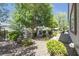 Lush backyard with manicured landscaping, a fenced perimeter, and a tranquil garden setting at 2421 Gamma Ray Pl, Henderson, NV 89044