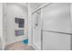 Bathroom with tiled floor features glass shower, and towel racks at 2421 Gamma Ray Pl, Henderson, NV 89044
