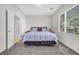 Large bedroom features neutral paint, carpet, ceiling fan, and a large window at 2421 Gamma Ray Pl, Henderson, NV 89044