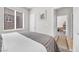 Neutral bedroom with window and view to the next room and ensuite bathroom at 2421 Gamma Ray Pl, Henderson, NV 89044