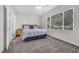 Spacious bedroom features neutral paint, carpet, large window, and a ceiling fan at 2421 Gamma Ray Pl, Henderson, NV 89044