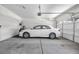 Spacious garage with ample room for parking a car and storage, equipped with an automatic door opener at 2421 Gamma Ray Pl, Henderson, NV 89044