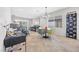 Cozy living and dining area with comfortable seating, modern decor, and ample natural light at 2421 Gamma Ray Pl, Henderson, NV 89044