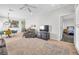 Open concept living room with stylish furniture, a ceiling fan, and a view into the dining and bedroom areas at 2421 Gamma Ray Pl, Henderson, NV 89044