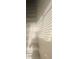 A stairway inside a house with white walls and sunlight shining through blinds at 2525 Donna St # L, North Las Vegas, NV 89030