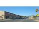 A street view of residential townhomes with blue sky and visible sidewalks and street at 2525 Donna St # L, North Las Vegas, NV 89030