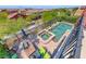 Aerial view of a backyard pool and spa area with a seating area and string lights above the patio at 2733 Auchmull St, Henderson, NV 89044