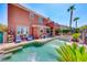 Spacious backyard featuring a pool with waterfall, hot tub, and outdoor seating area, great for entertaining at 2733 Auchmull St, Henderson, NV 89044