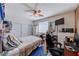 Contemporary bedroom with a ceiling fan, a desk area, and ample storage, providing a comfortable and functional living space at 2733 Auchmull St, Henderson, NV 89044
