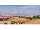 Scenic cityscape featuring a vibrant city skyline and distant mountains, as seen from a neighborhood with terracotta rooftops at 2733 Auchmull St, Henderson, NV 89044
