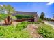 Beautiful entrance to the Calgary community with lush landscaping and mature palm trees at 2733 Auchmull St, Henderson, NV 89044