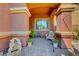 Charming front porch with seating, potted plants, a brick walkway and a decorative fountain feature at 2733 Auchmull St, Henderson, NV 89044