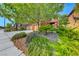 Front yard featuring desert landscaping, shrubs and a home with a three-car garage at 2733 Auchmull St, Henderson, NV 89044