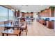 Spacious kitchen with island, stainless appliances, and a dining area with large windows and natural light at 2733 Auchmull St, Henderson, NV 89044