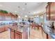 Open-concept kitchen with island, stainless appliances, cabinetry, and connected dining area with great light at 2733 Auchmull St, Henderson, NV 89044