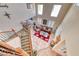 High angle of a bright living room with high ceilings, comfortable seating, and staircase at 2733 Auchmull St, Henderson, NV 89044