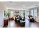 Spacious main bedroom boasts wood floors, plantation shutters, seating area, and abundant natural light at 2733 Auchmull St, Henderson, NV 89044