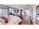 Bright main bedroom featuring wood floors, plantation shutters, and views of the neighborhood at 2733 Auchmull St, Henderson, NV 89044