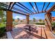 Shaded community picnic area with grill, table, seating and paved patio at 2733 Auchmull St, Henderson, NV 89044