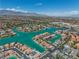 Beautiful aerial view of the community, featuring waterfront homes, lush landscaping, and mountain backdrop at 3061 Waterside Cir, Las Vegas, NV 89117