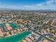 Panoramic aerial shot of the community, showcasing the canals, diverse homes, and city skyline in the distance at 3061 Waterside Cir, Las Vegas, NV 89117