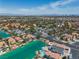 Expansive aerial shot of the residential community, highlighting the beautiful lake system and diverse housing styles at 3061 Waterside Cir, Las Vegas, NV 89117