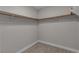 Walk-in closet with wood shelf and rod to organize your wardrobe at 3061 Waterside Cir, Las Vegas, NV 89117