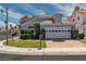 Charming single-Gathering home features a well-manicured lawn and a two-car garage at 3061 Waterside Cir, Las Vegas, NV 89117