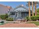 Charming single-story home on the water with a private dock and lush landscaping at 3061 Waterside Cir, Las Vegas, NV 89117