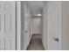 Hallway features multiple doors, plank flooring, and recessed lighting at 3061 Waterside Cir, Las Vegas, NV 89117