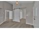 Hallway with hardwood floors, sliding door, and neutral wall color at 3061 Waterside Cir, Las Vegas, NV 89117