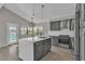 Modern kitchen features stainless steel appliances, an island, and backyard views at 3061 Waterside Cir, Las Vegas, NV 89117