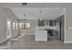 Contemporary kitchen equipped with stainless steel appliances, a sleek island, and ample natural light at 3061 Waterside Cir, Las Vegas, NV 89117
