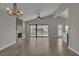 Bright living room boasts wood floors, fireplace, and sliding glass doors to the backyard at 3061 Waterside Cir, Las Vegas, NV 89117