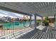 Covered patio overlooking tranquil canal, perfect for outdoor relaxing and entertaining at 3061 Waterside Cir, Las Vegas, NV 89117