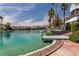 Beautiful waterfront view featuring the calm canal and homes with private docks at 3061 Waterside Cir, Las Vegas, NV 89117