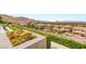 Landscaped backyard with mature trees overlooking hillside and city at 34 Olympia Outlook Dr, Las Vegas, NV 89141