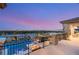 Balcony with a panoramic view of city and pool area with cozy seating, great for relaxation and entertainment at 34 Olympia Outlook Dr, Las Vegas, NV 89141