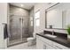 Modern bathroom with a glass-enclosed shower, sleek vanity, and neutral color palette for a clean aesthetic at 34 Olympia Outlook Dr, Las Vegas, NV 89141