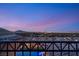 Elevated view showcasing a twilight cityscape from a luxury home, highlighting urban views and residential elegance at 34 Olympia Outlook Dr, Las Vegas, NV 89141