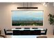 Elegant dining area with scenic city views, featuring a modern table and stylish seating at 34 Olympia Outlook Dr, Las Vegas, NV 89141