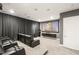 Home theater with tiered seating, large screen, and dark curtains for an immersive viewing experience at 34 Olympia Outlook Dr, Las Vegas, NV 89141