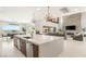 Open-concept kitchen with a large island, seamlessly connected to the living and dining areas at 34 Olympia Outlook Dr, Las Vegas, NV 89141