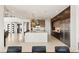 Spacious kitchen with an island, stainless steel appliances, and sleek cabinetry, open to the living area at 34 Olympia Outlook Dr, Las Vegas, NV 89141